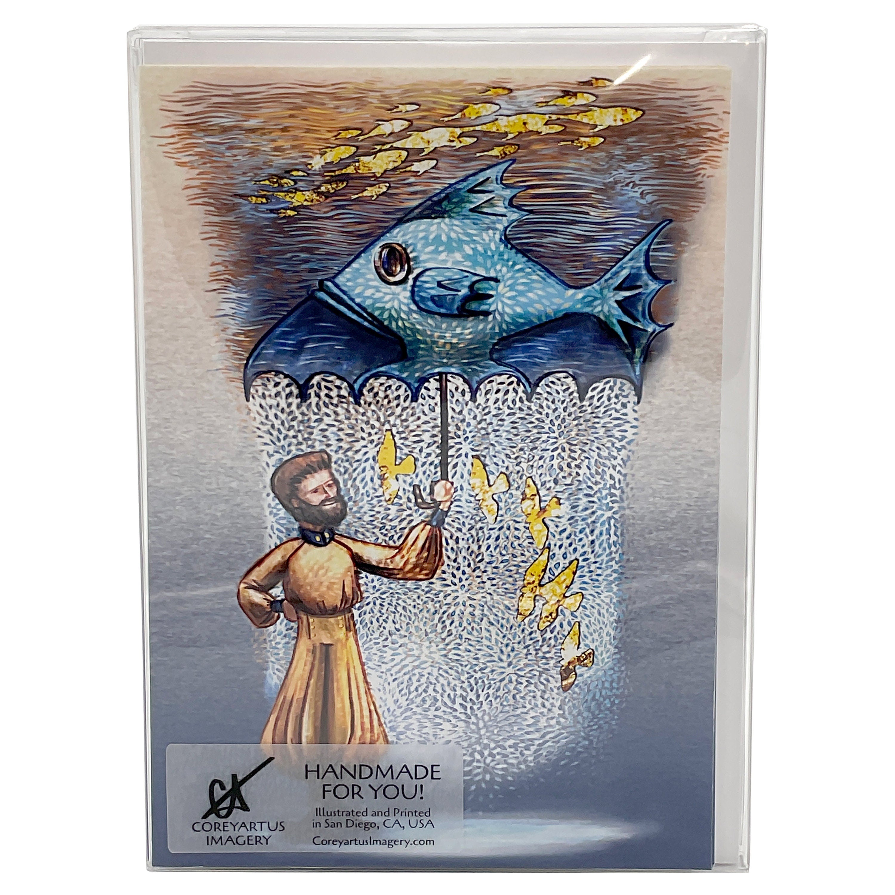 Illustrated card with a person and fish umbrella  design, packaged in a clear box.