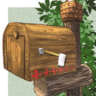 Wooden mailbox with axe design and beehive on top, surrounded by green foliage.