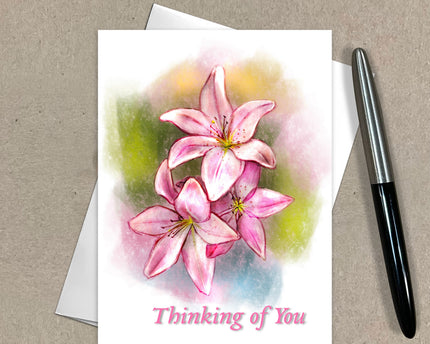 Greeting card with pink flowers and 'Thinking of You' text on a beige background