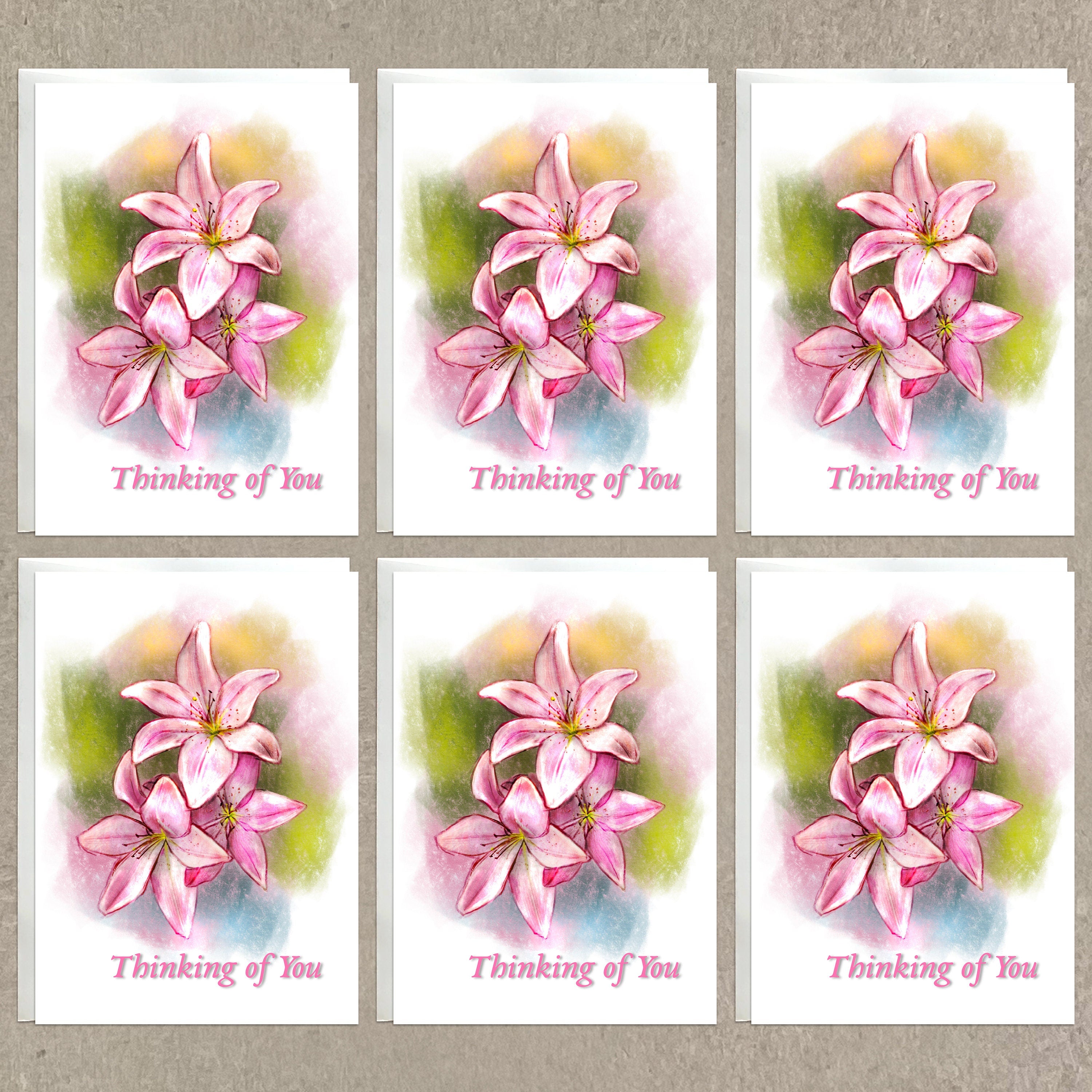 Set of six 'Thinking of You' cards with pink floral designs on a textured beige background.