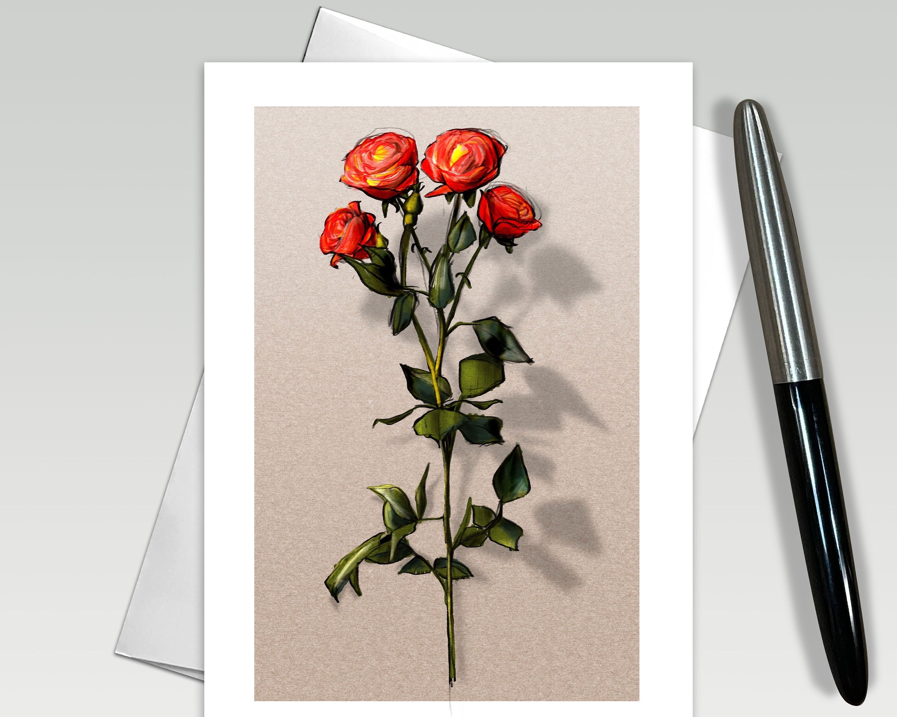 Greeting card with red roses on a beige background, next to a pen.