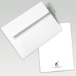 White envelope and card with a visible brand logo on a gray background