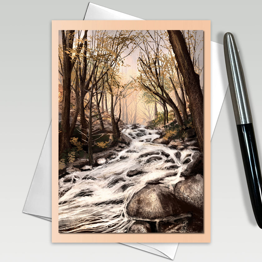 Greeting card with a forest stream design, pen on the side