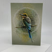 Card with a colorful bird illustration on a textured green background