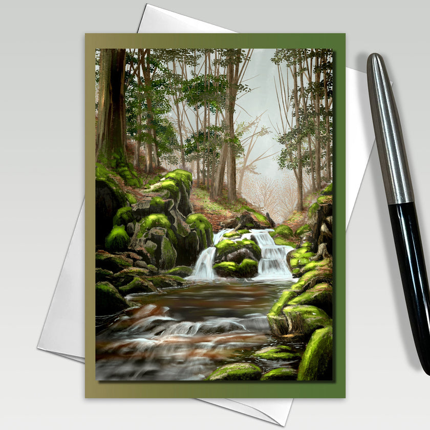 Greeting card with a forest scene featuring a stream and waterfall, with a pen on the side.