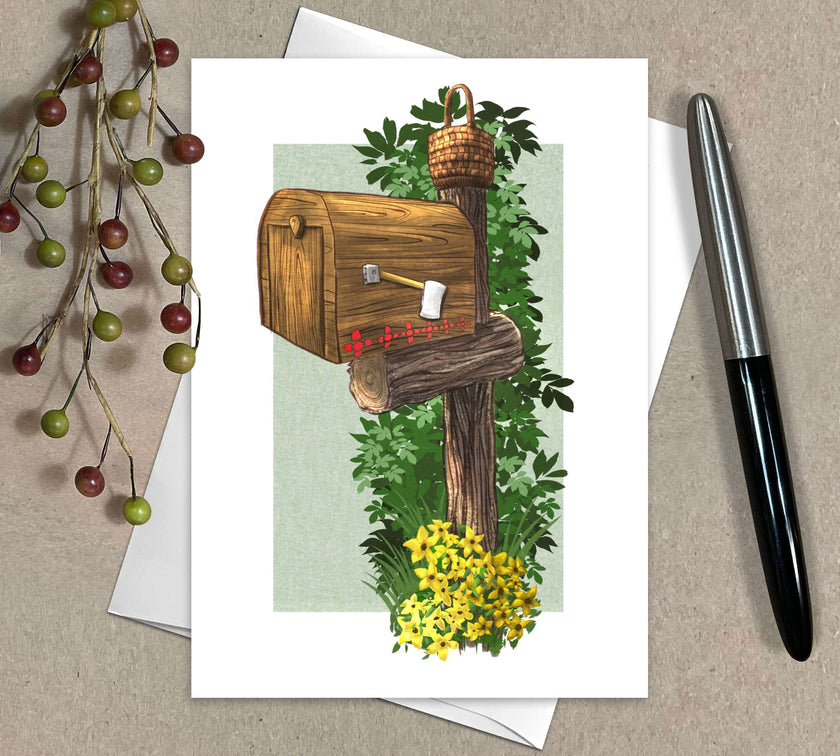 Greeting card with a wooden mailbox illustration on a pale green textured background on white, with a pen and decorative elements.