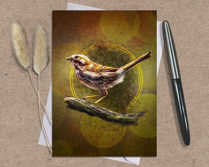 Greeting card with a bird illustration on a textured surface with a pen and dried plants.