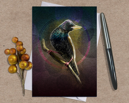 Greeting card with a bird illustration on a textured surface with a pen and berries.