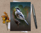 Greeting card with a bird illustration on a textured surface with a pen and decorative elements.