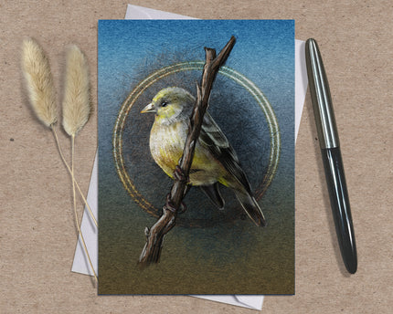 Card with a bird illustration on a branch, accompanied by dried plants and a pen on a textured surface.