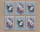 Set of six cards with floral designs on a textured beige background