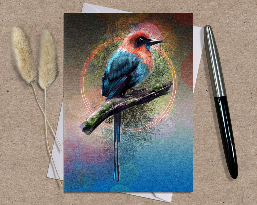Greeting card with a colorful bird illustration on a textured surface with a pen and dried plants.