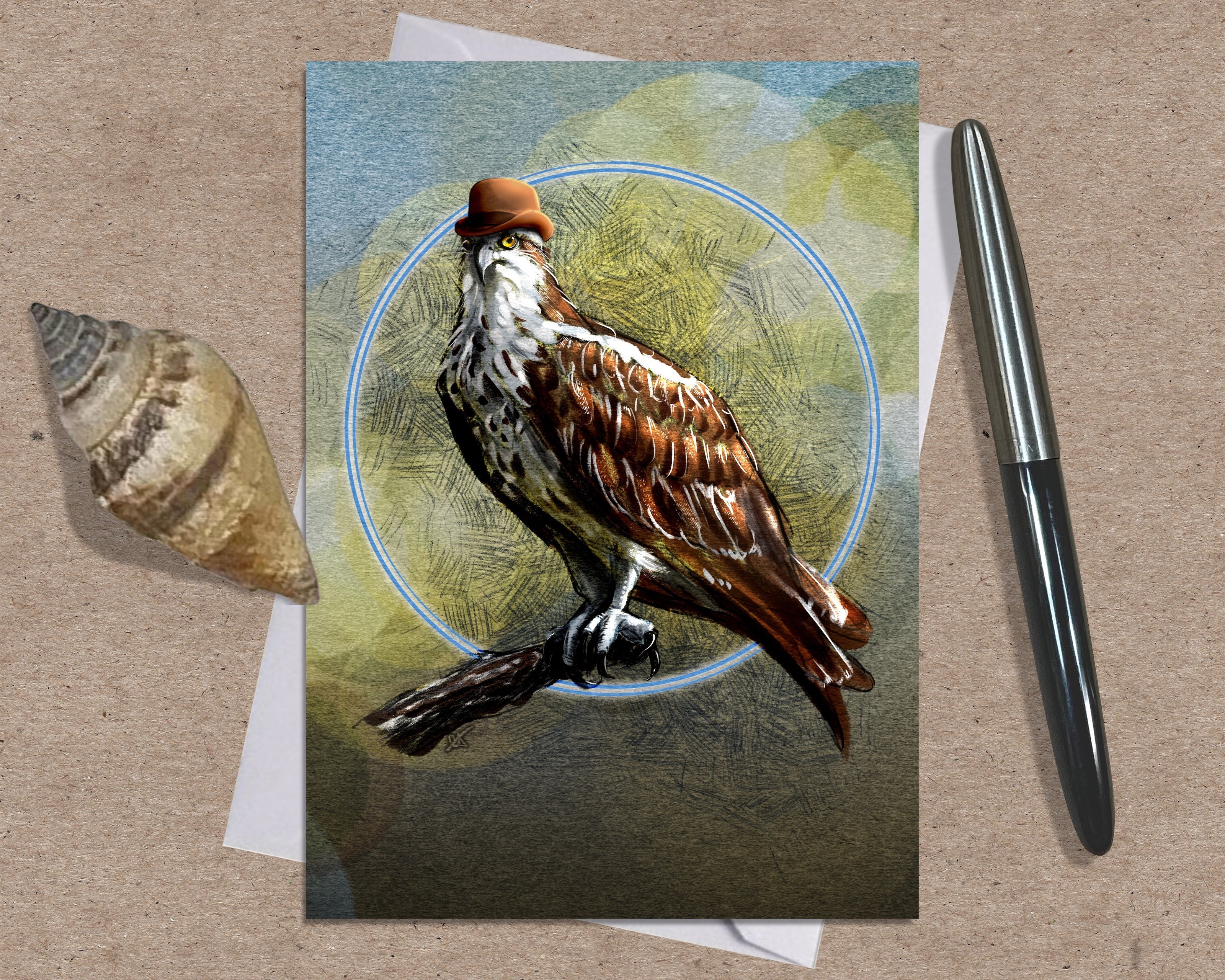 Greeting card with a bird illustration on a textured surface with a shell and pen.