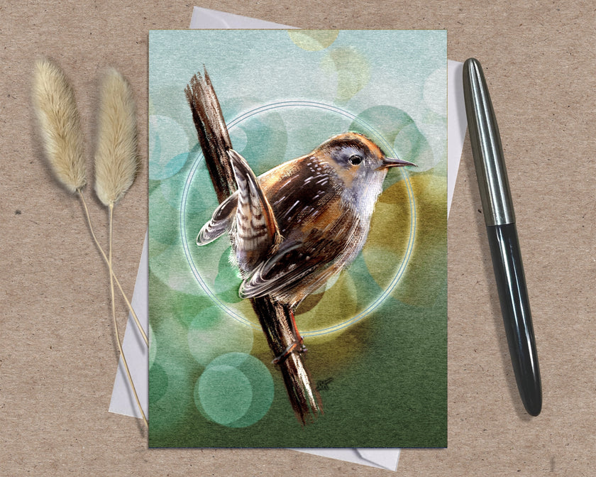 Greeting card with a bird illustration on a textured surface with a pen and dried plants.