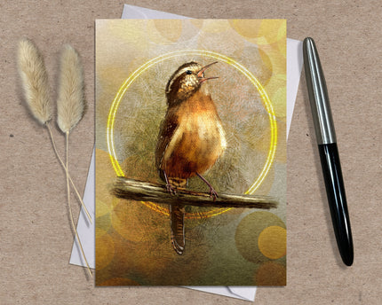 Greeting card with a bird illustration on a textured surface with a pen and dried plants.
