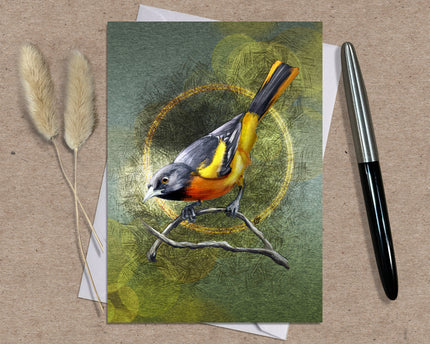 Greeting card with a bird illustration on a textured surface with a pen and dried plants.