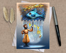 Greeting card with an illustration of a man and fish on a textured surface with a pen and dried plants.