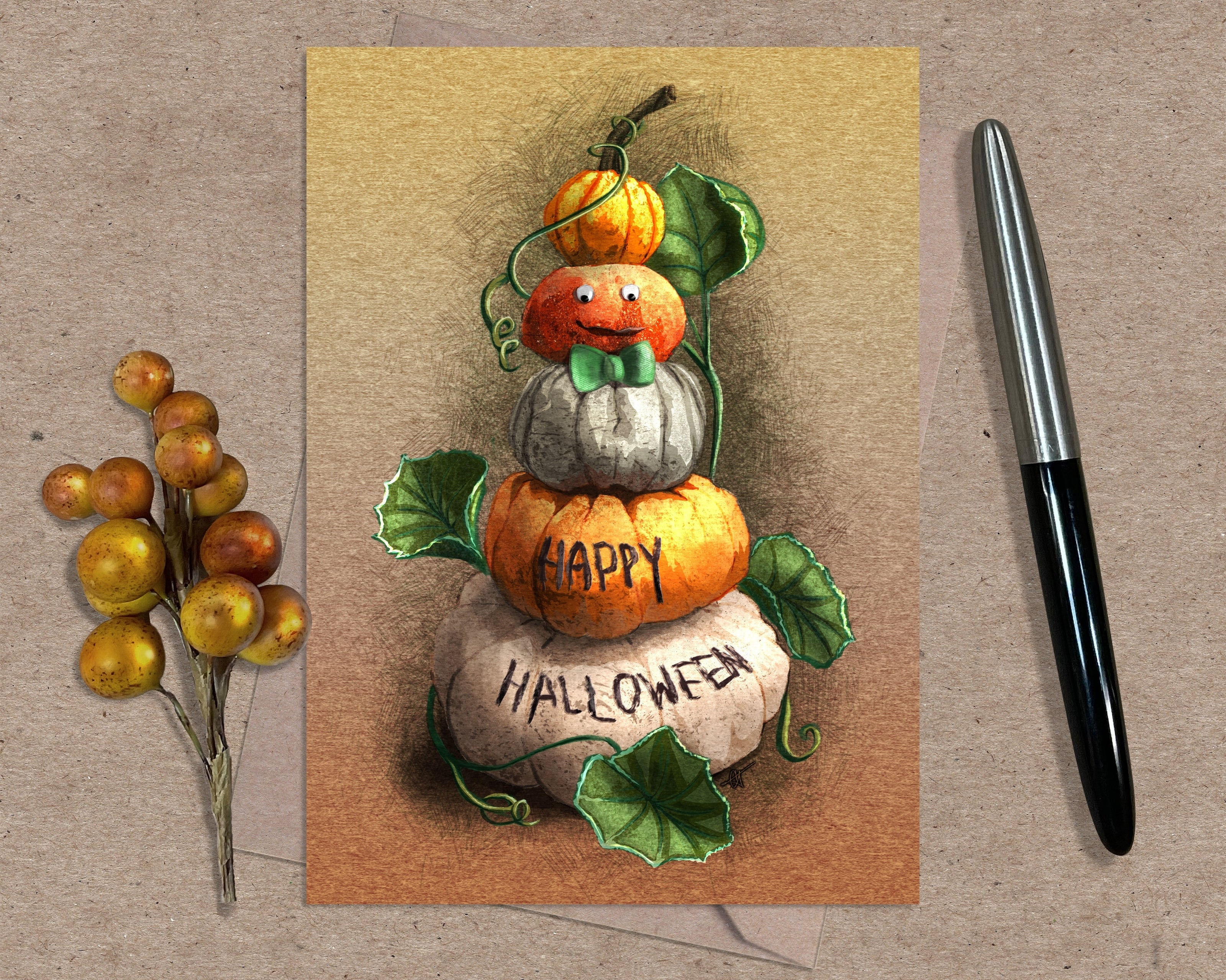 Halloween-themed card with pumpkins and berries on a textured surface with a pen.