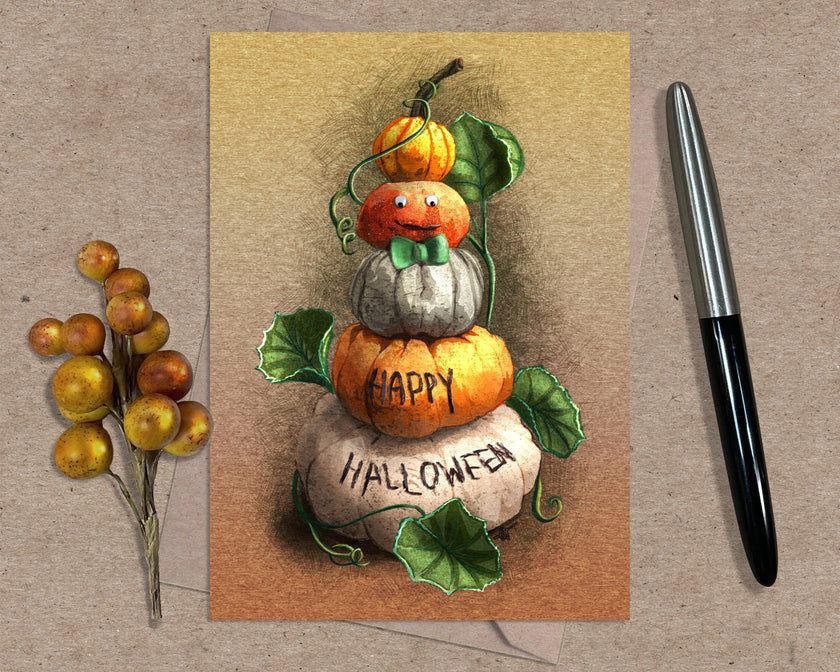 Halloween-themed card with pumpkins and berries on a textured surface with a pen.