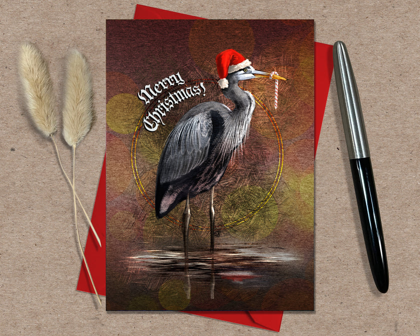 Christmas card with a heron wearing a Santa hat on a red envelope with a pen and decorative elements.