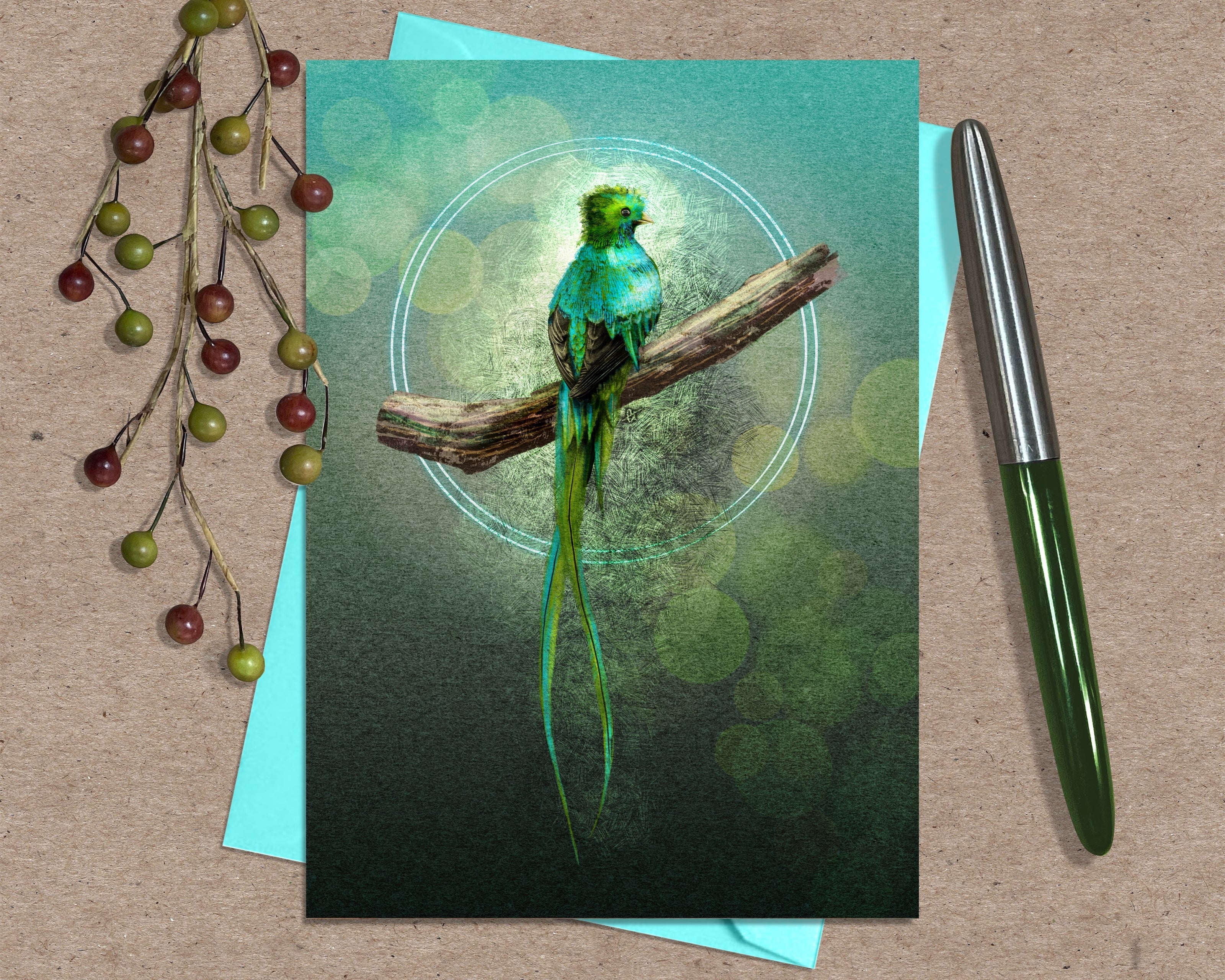 Greeting card with a green parrot design on a brown surface with a pen and decorative branch.