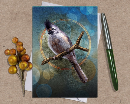 Greeting card with a bird illustration on a textured surface with a pen and decorative elements.