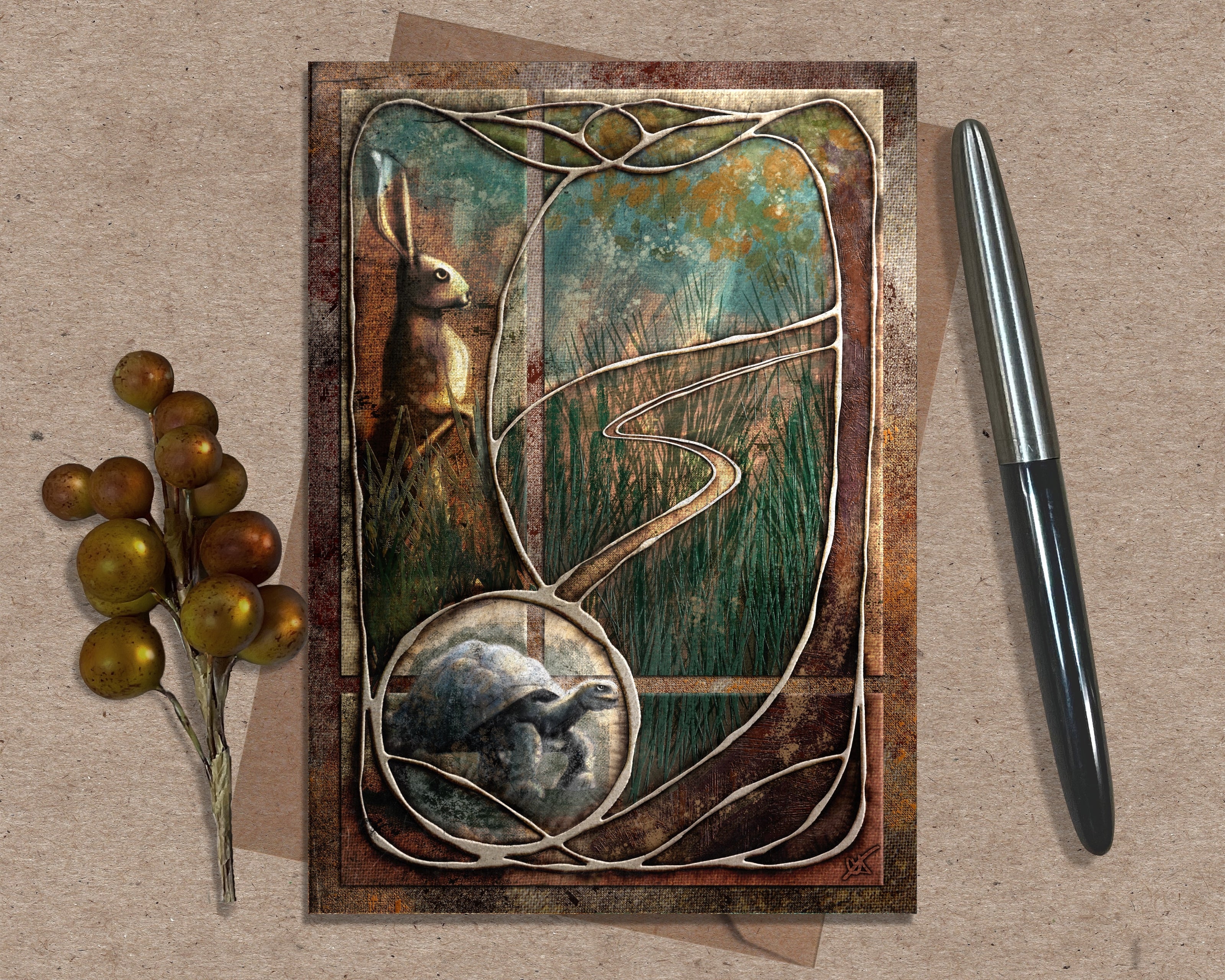 Decorative greeting card with rabbit and tortoise illustration on a textured surface with a pen and decorative elements.
