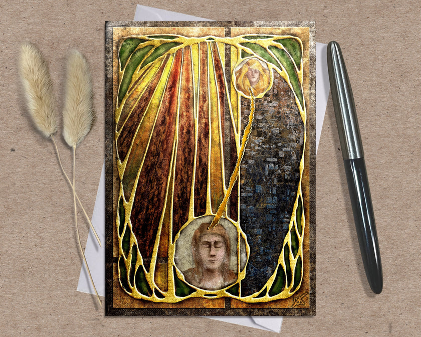 Decorative greeting card with artistic design and a pen on a textured surface