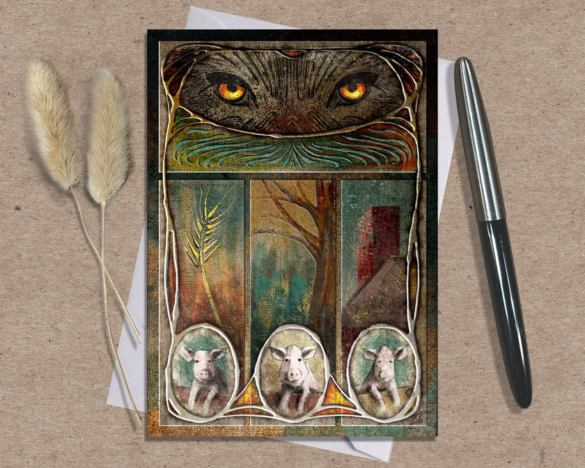 Decorative greeting card with wolf eyes and three small animal portraits on a textured surface with a pen and dried plants.