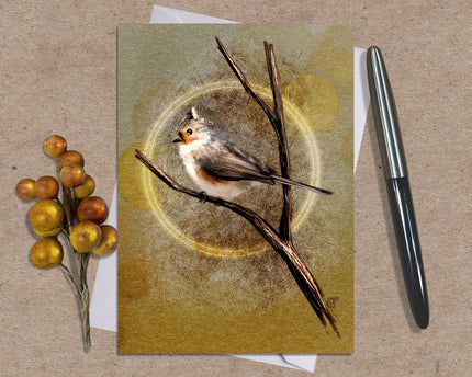 Greeting card with a bird illustration on a branch, surrounded by berries and a pen on a textured surface.