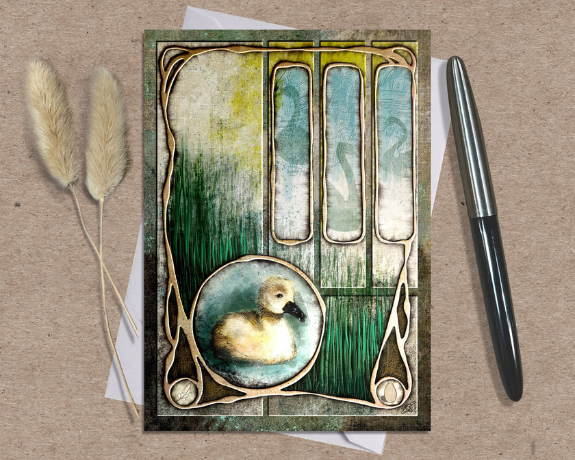 Decorative card with a duck illustration on a textured surface with a pen and dried plants.