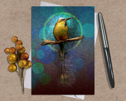 Greeting card with a colorful bird illustration on a textured surface with a pen and decorative elements.