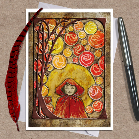 Greeting card with autumn-themed design featuring a person in a red hood and colorful leaves on a brown background.
