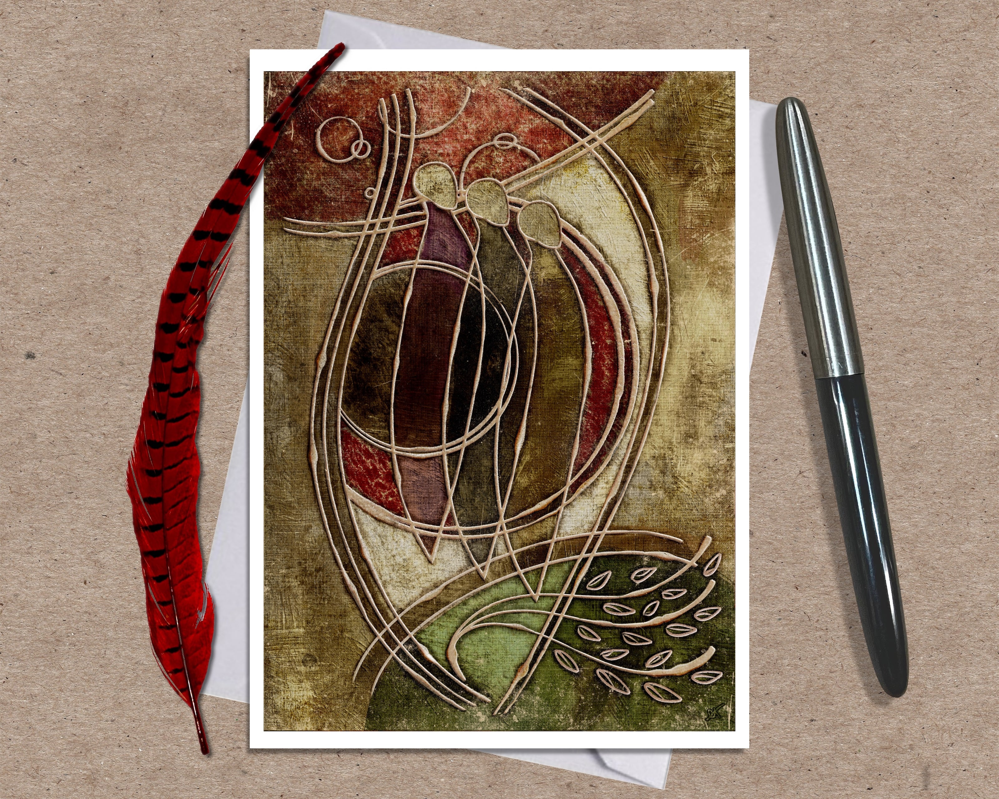 Decorative greeting card with abstract design on a textured surface with a pen and feather.