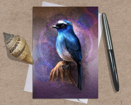 Greeting card with a blue bird illustration on a brown surface with a shell and pen.