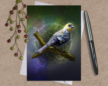 Greeting card with a bird illustration on a brown surface with a pen and decorative elements.