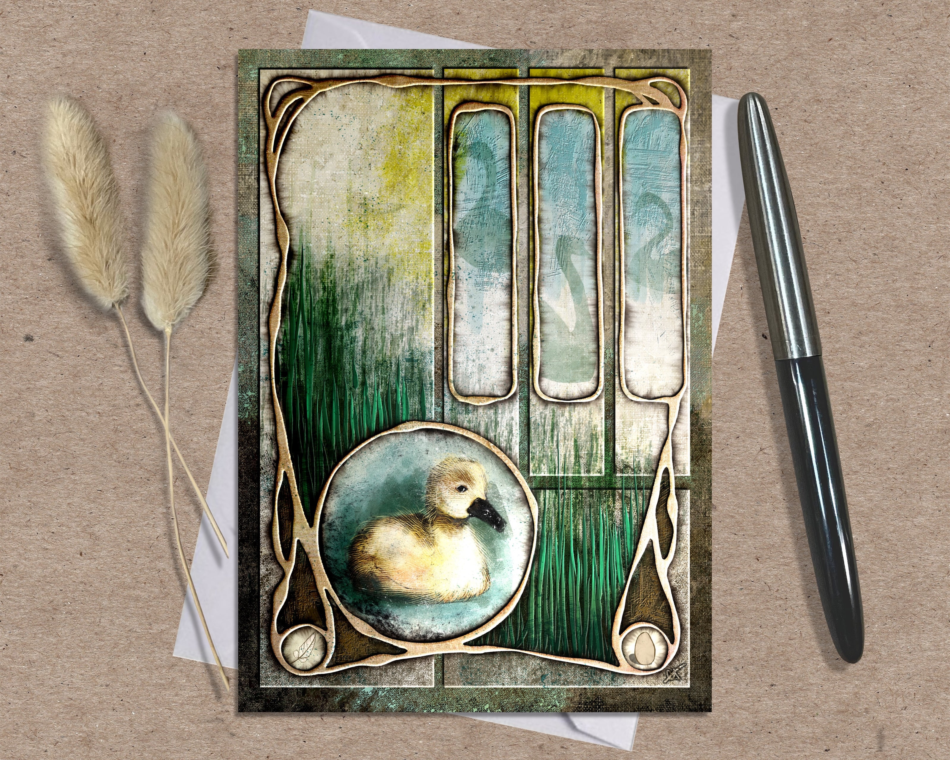 Decorative card with a duck illustration on a textured surface with a pen and dried plants.