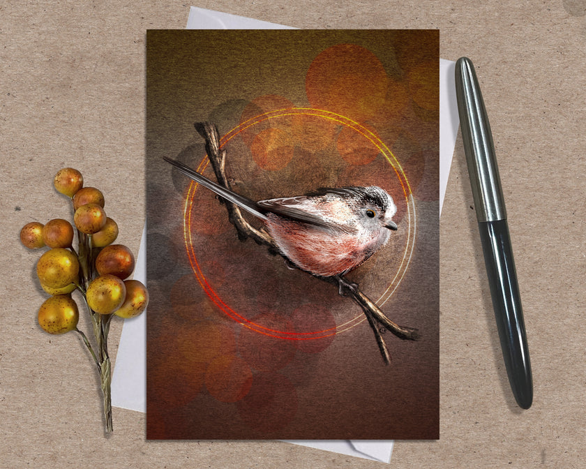 Greeting card with a bird illustration on a brown background, accompanied by a pen and decorative branch.