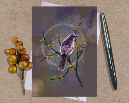 Greeting card with a bird illustration on a textured surface with a pen and decorative branch.