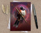 Greeting card with a bird illustration on a textured surface with a pen and dried plants.
