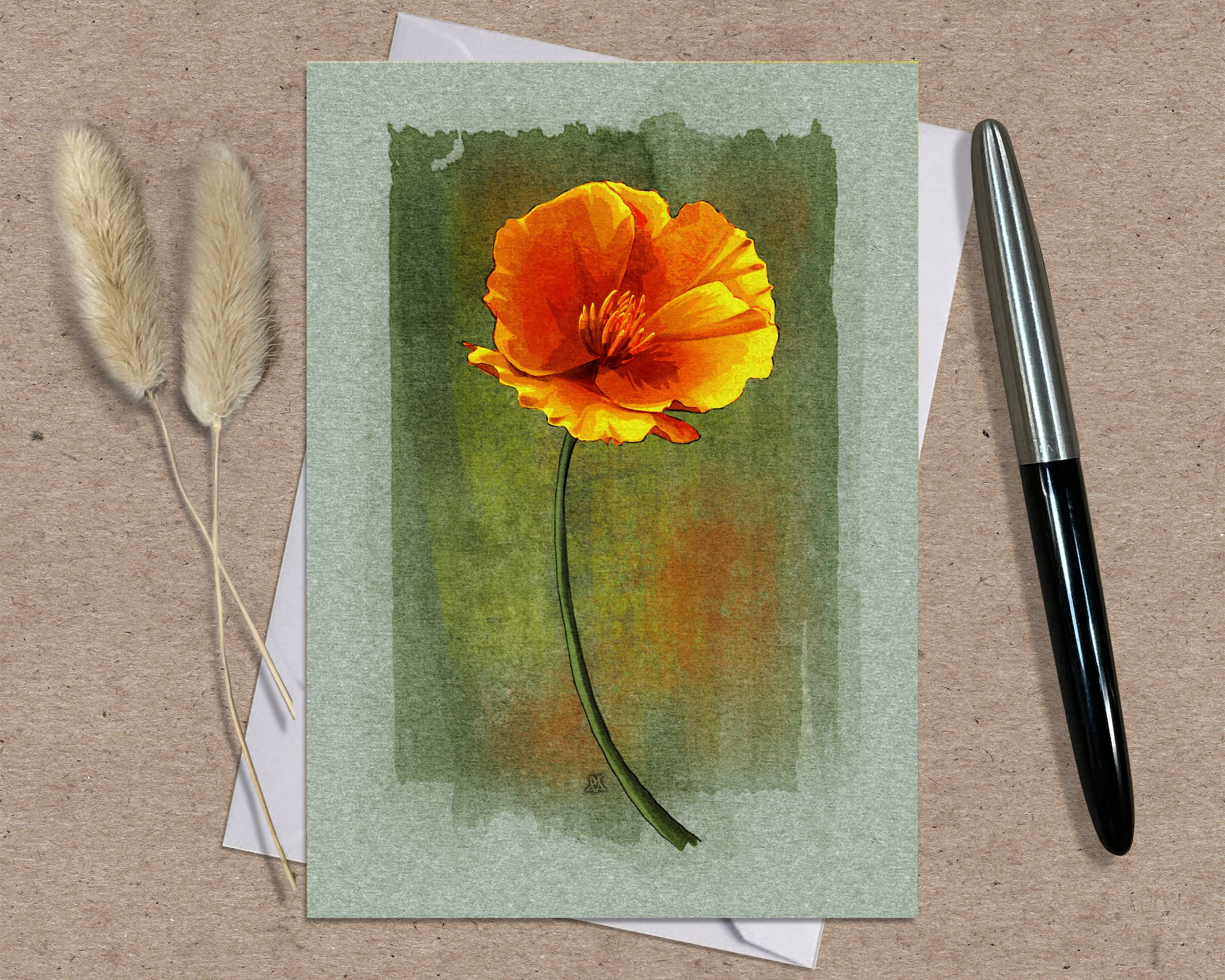 Greeting card with a watercolor orange flower on a textured surface with a pen and dried plants.