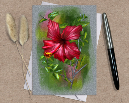 Greeting card with a red flower illustration on a textured surface with a pen and dried plants.