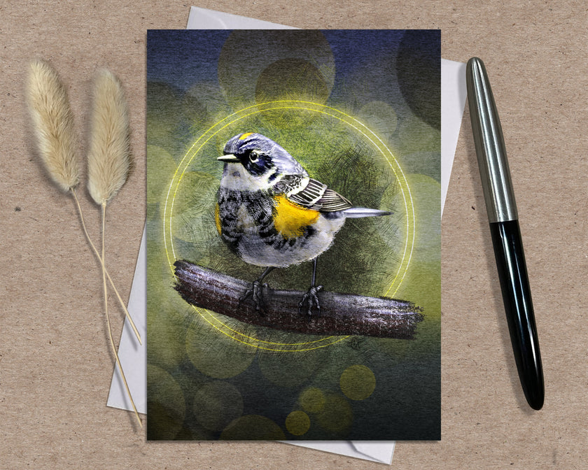 Card with a bird illustration on a textured surface with a pen and dried plants.